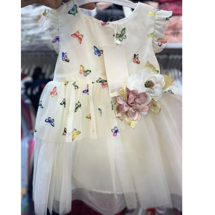 Robe de fête ivoire à motifs papillons pour petite fille