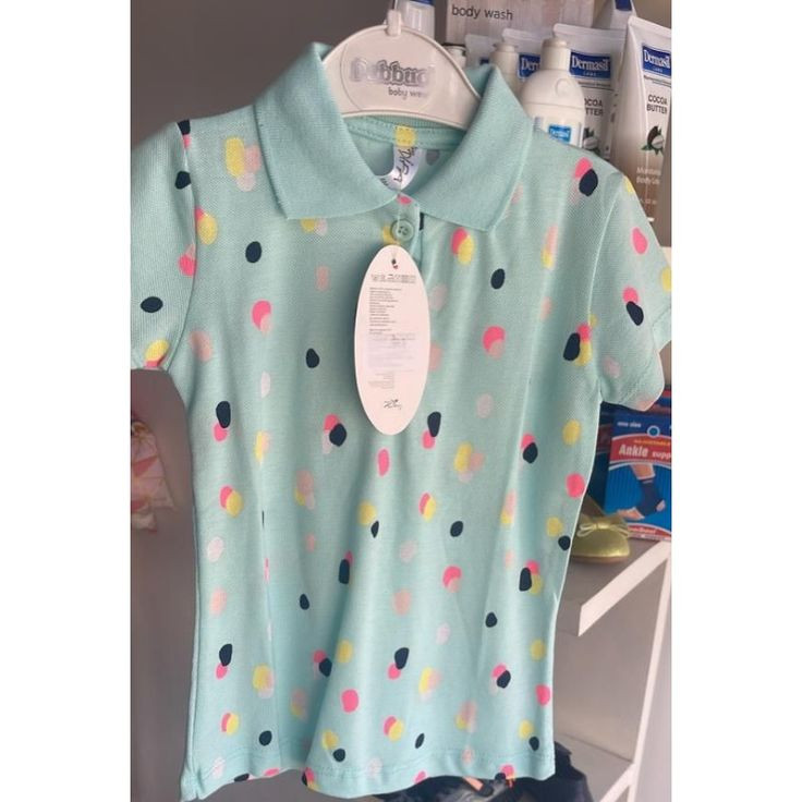 Polo enfant vert d'eau à pois colorés